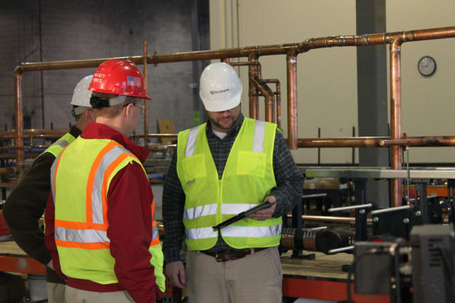 ManufactOn customer TG Gallagher, which utilizes ManufactOn in the fabrication shop, is discussing when an item is scheduled to be delivered to the jobsite, and checking the production status for the item. (Image courtesy of TG Gallagher.)