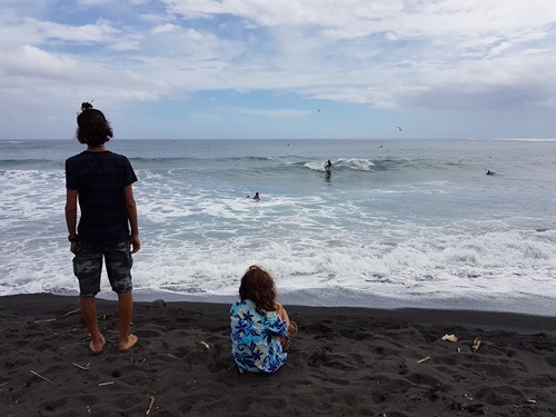 The boys watching surfers