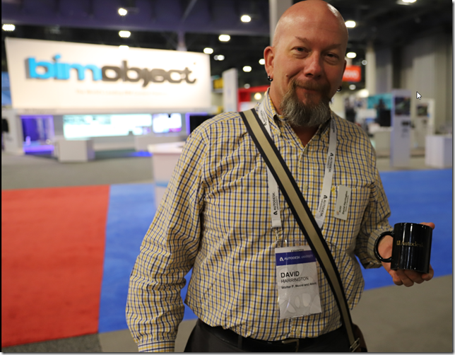 David Harrington giving an old Autodesk coffee mug.