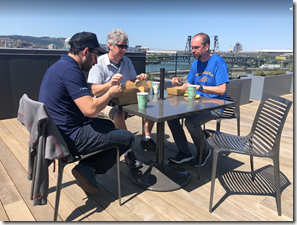 Employees eating lunch on the deck.