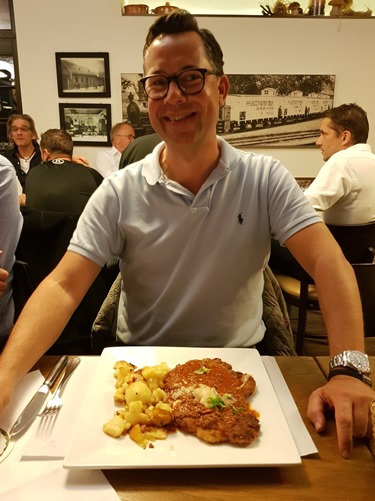 Sander trying schnitzel with Bolognaise sauce
