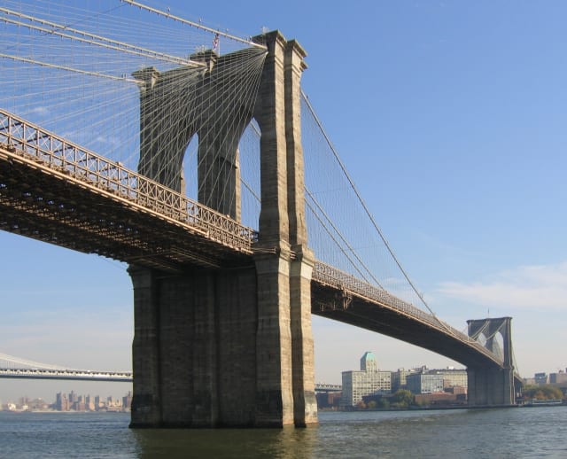 The Brooklyn Bridge, one of New York’s most famous attractions, as seen from water level. One of the projects supported by the DoT’s new round of BUILD funding is rehabilitating the bridge’s masonry arches for the first time in more than a hundred years. (Image courtesy of Postdlf, Wikimedia Commons.)