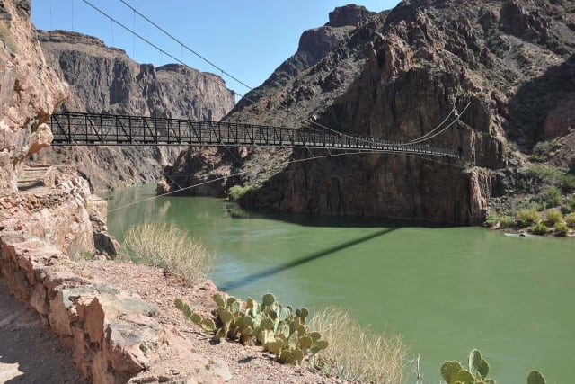 Don’t let its delicate appearance fool you: the Kaibab Bridge has been standing since 1928, and still welcomes tens of thousands of visitors every year. (Image courtesy of Grand Canyon Explorer.)