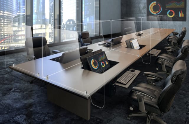 Fixed or movable barriers, along with maintaining social distancing guidelines, will likely be included in new office layouts. (Image courtesy of SMARTdesks.)