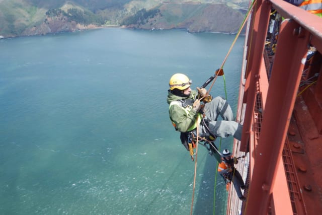 They don’t teach this in school. A bridge inspector rappels down the South Tower (the San Francisco side) of the Golden Gate Bridge for its 2018 inspection. (Picture courtesy of San Francisco Examiner.)